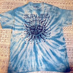 Sublime tie-dye tee featuring iconic sun logo design in black on a blue tie-dye